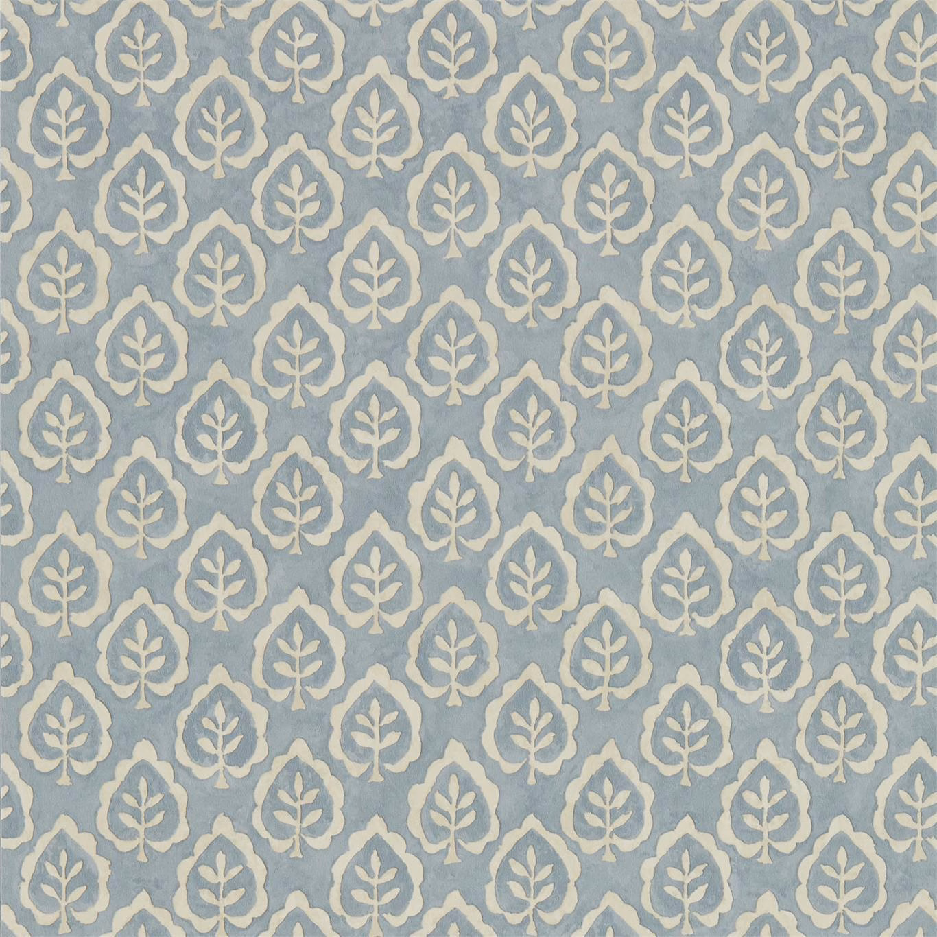 Dusty blue-grey wallpaper with repeating ivory leaf medallions and softly mottled texture