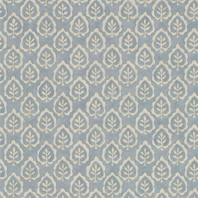 Dusty blue-grey wallpaper with repeating ivory leaf medallions and softly mottled texture
