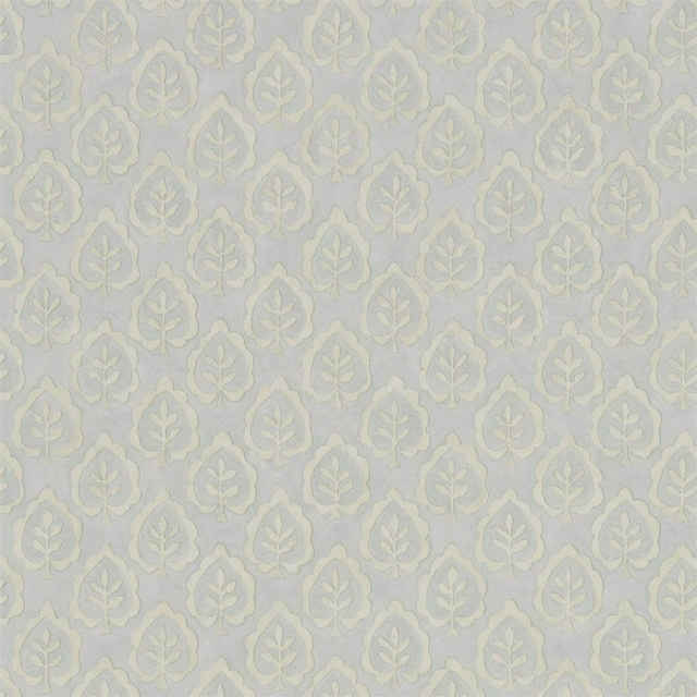 Pale blue-grey wallpaper with repeating sage leaf medallions and chalky ivory details