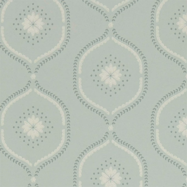 Pale mist-blue wallpaper with cream floral medallions and muted sage dotted detailing