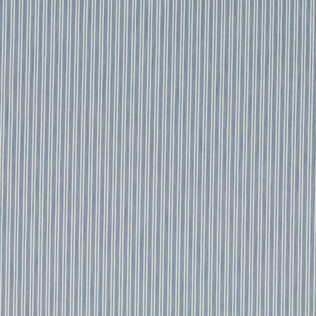 Close-up of narrow vertical blue and ivory pinstripes on a woven fabric swatch