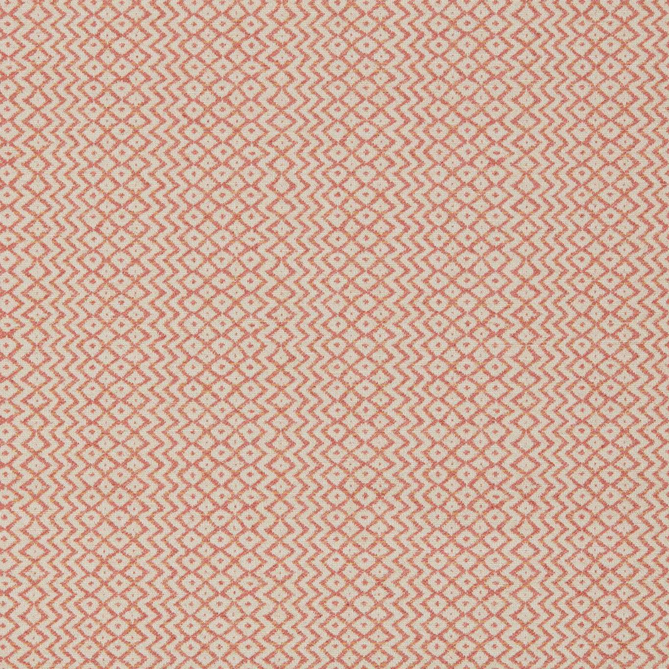 Close-up of a warm sandstone geometric weave with terracotta zigzags and speckled accents