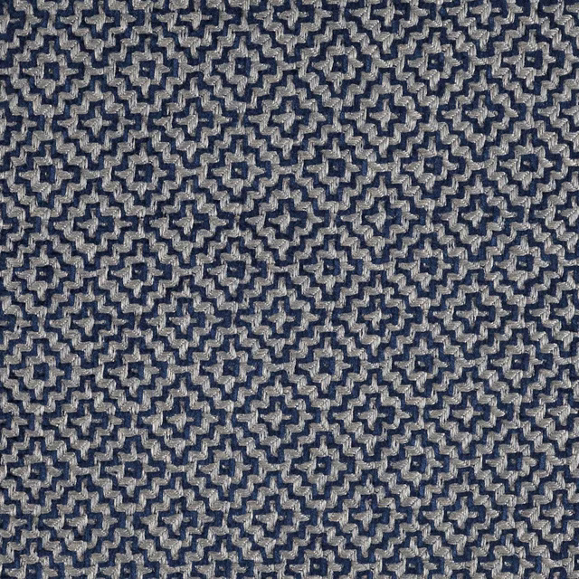 Close-up of indigo blue geometric woven fabric with small cream accents