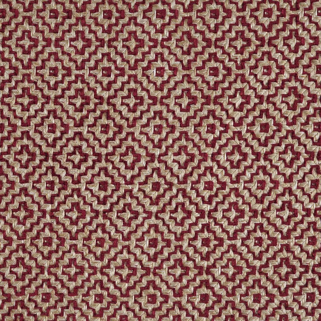 Close-up of a russet red and stone geometric woven fabric with small repeating motif