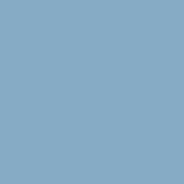a flat tile of soft grey-blue paint