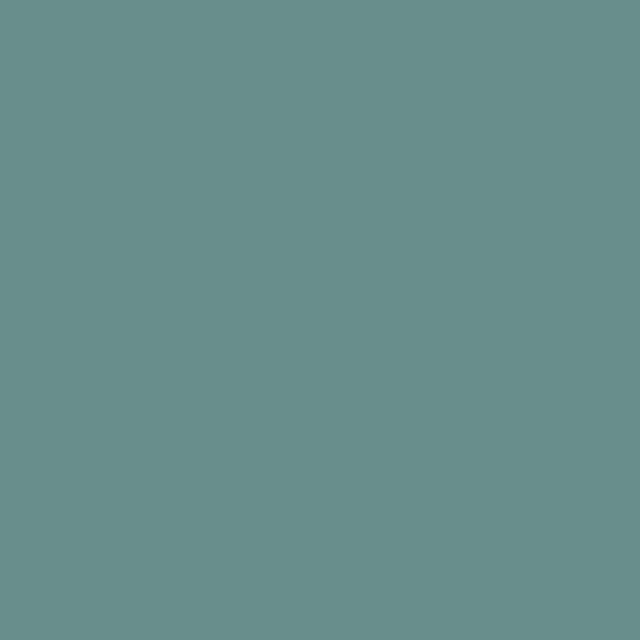 a flat tile of muted green-blue paint