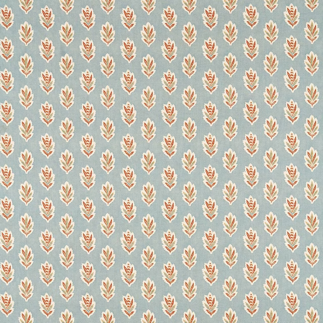 Small cream leaf motifs on a soft blue clay ground with warm terracotta accents