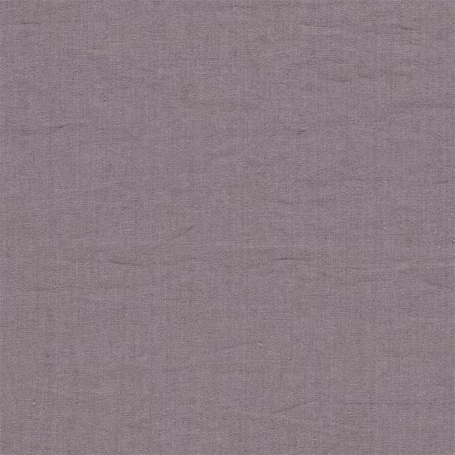 Close-up of dusty mauve pink plain linen with a soft slubbed texture
