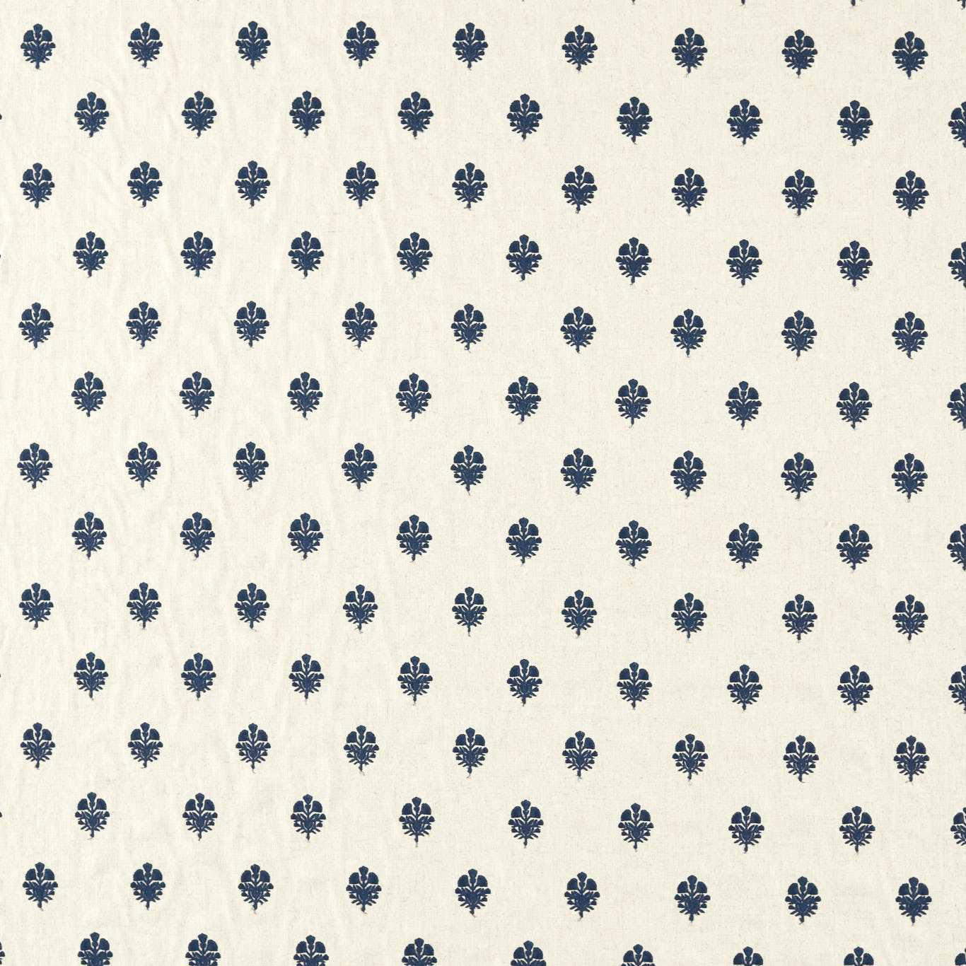 Cream fabric swatch with small indigo repeating motifs