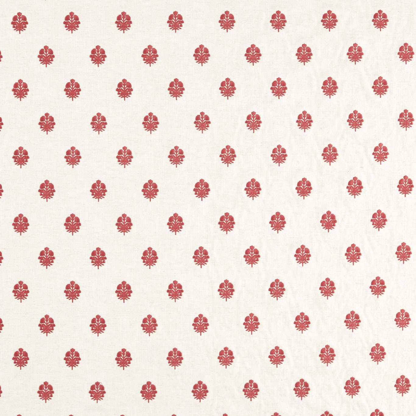 Small madder-red ikat motifs on an ivory woven fabric swatch