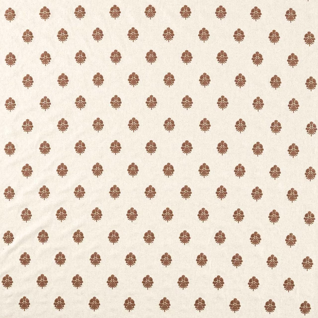 Ivory woven fabric with small terracotta-brown damask motifs in an even repeat