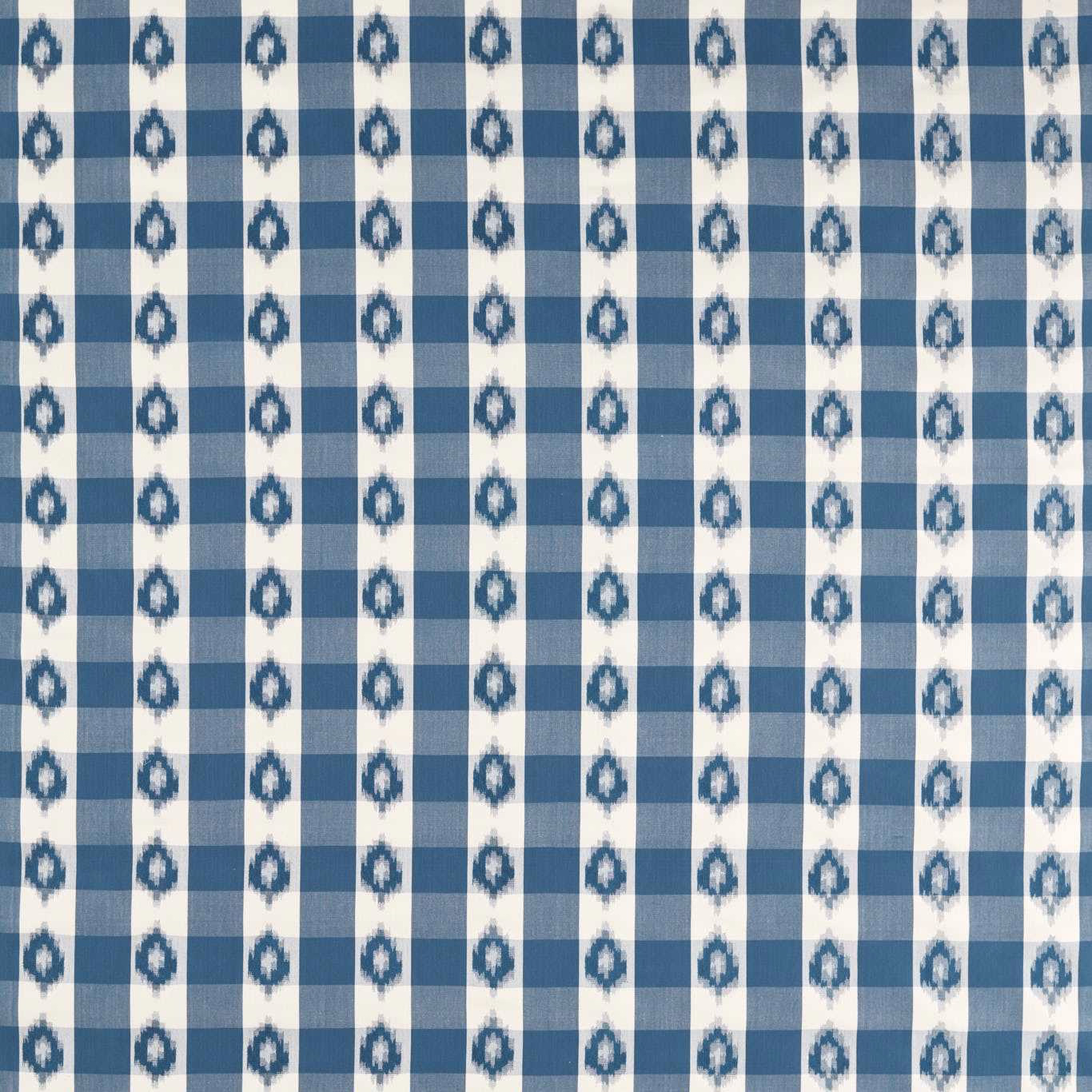 Blue and cream checked fabric with small indigo ikat teardrops