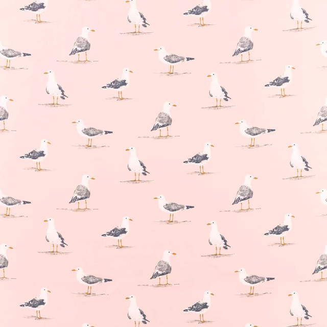 Blush pink fabric with scattered grey and white seabirds
