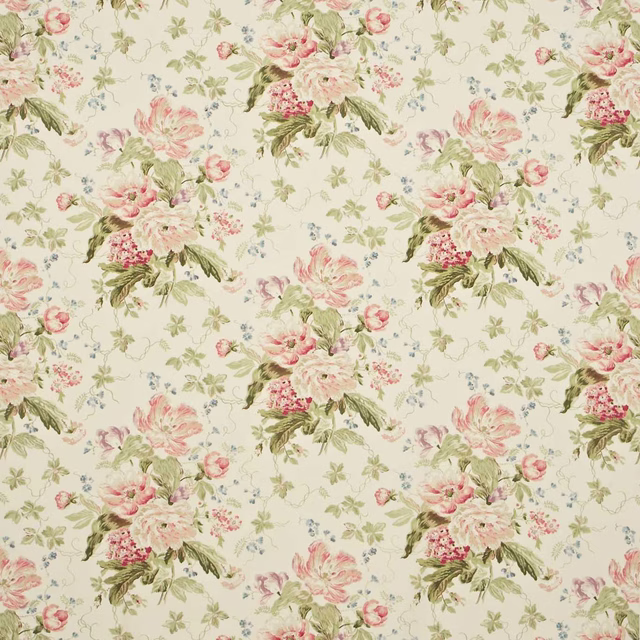 Cream floral fabric with rose blooms, green leaves and small blue sprigs