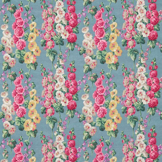 Petrol blue floral fabric with vertical pink, cream and yellow hollyhock stems