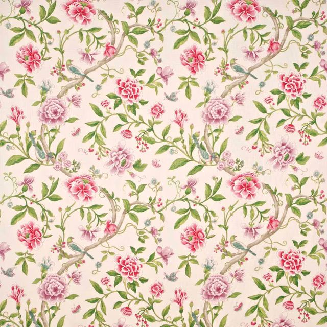 Large-scale magenta and pink floral print with leaf green stems on a cream ground