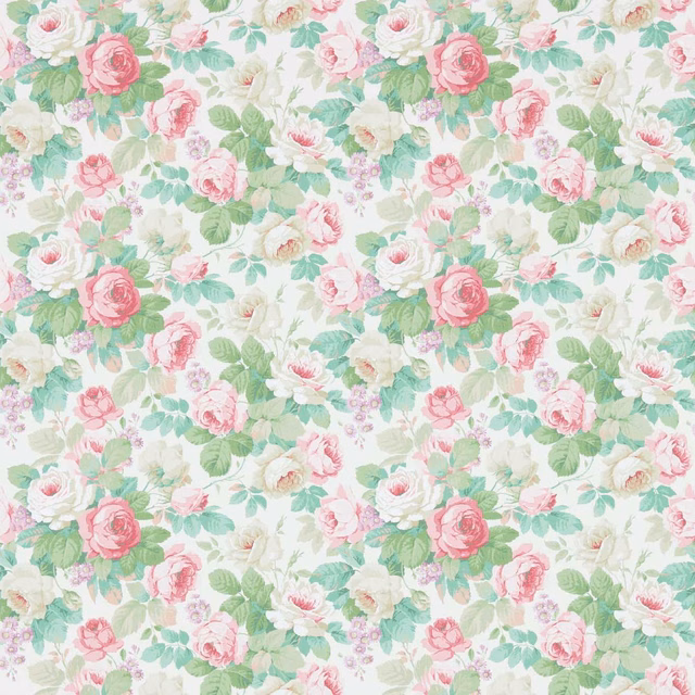 Soft pink roses and celadon leaves in a dense floral wallpaper on cream