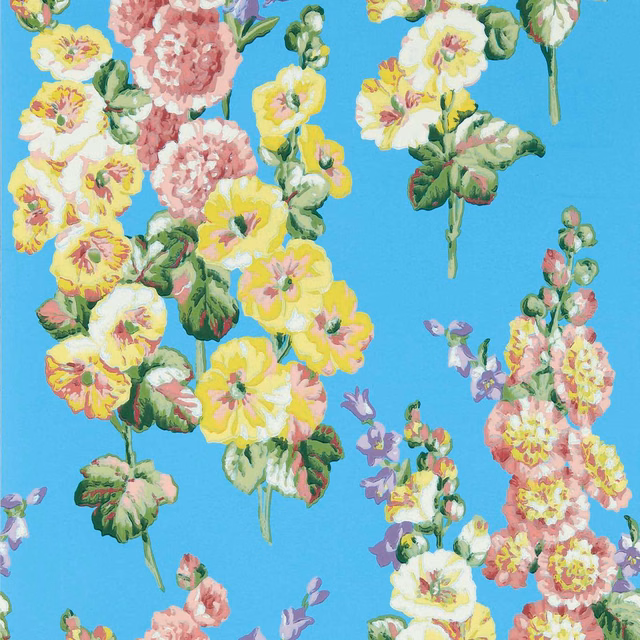 Bright turquoise-blue wallpaper with pink, yellow and white hollyhocks in painterly clusters