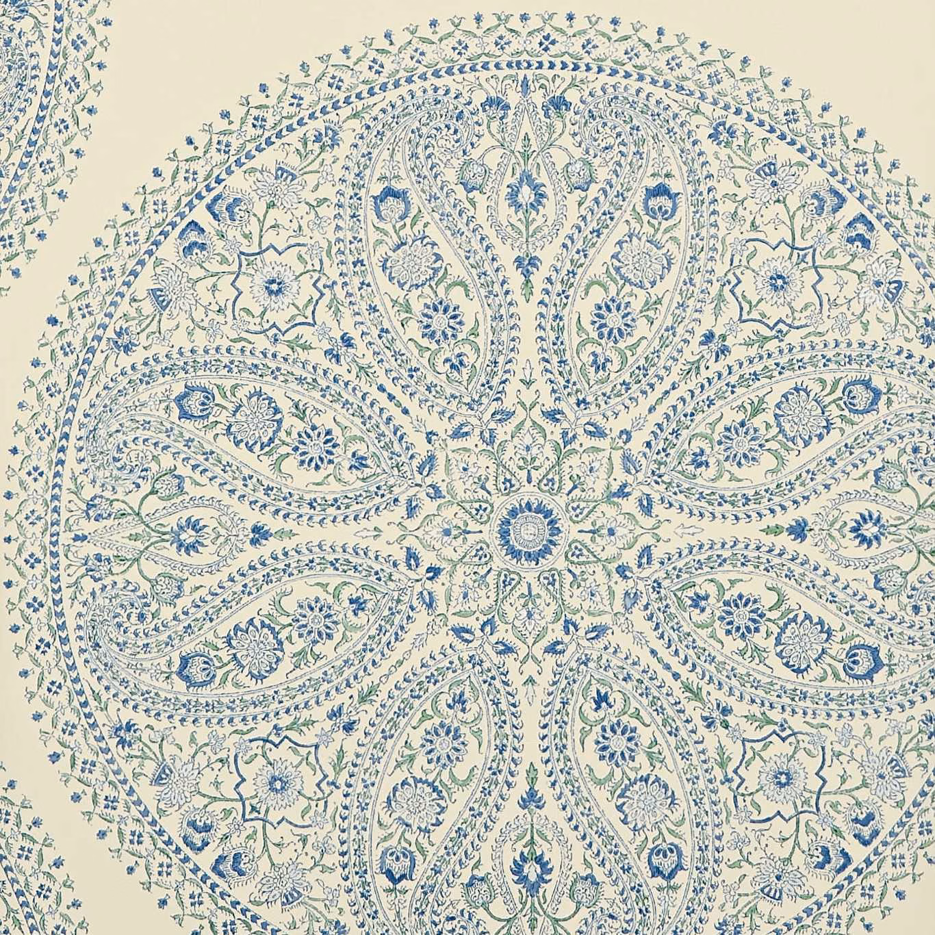 Cream wallpaper with a large muted-blue floral paisley medallion and fine radial linework