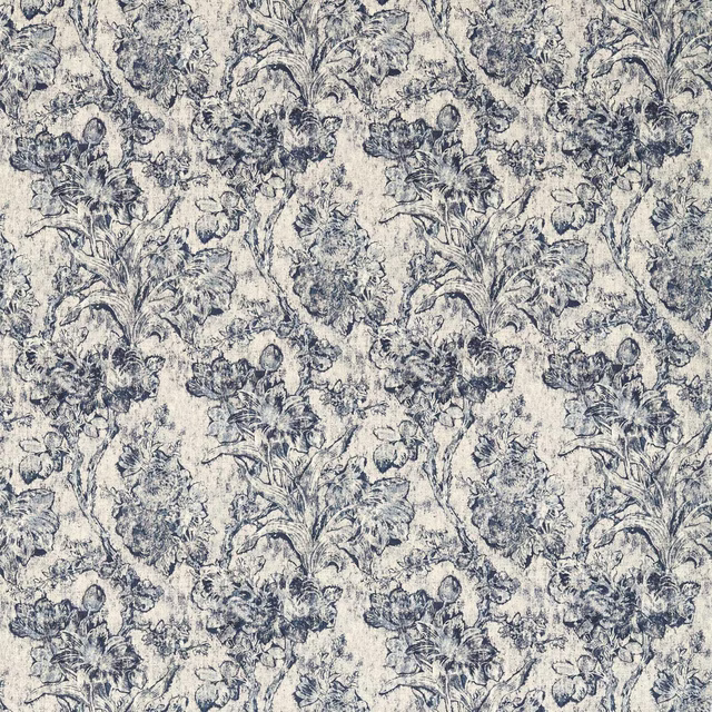 Blue-grey floral toile fabric on a pale ground with a softly weathered print
