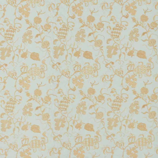 Pale smog blue woven fabric with warm gold botanical motif