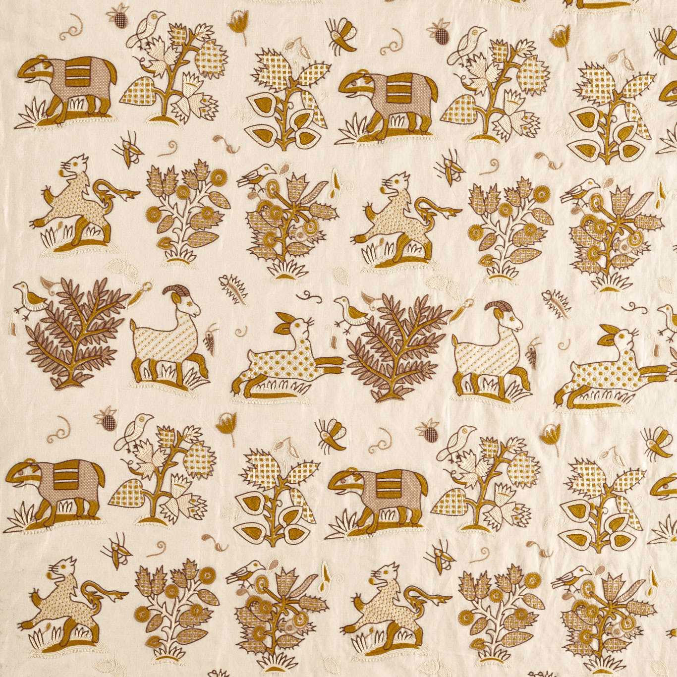 Cream fabric swatch with harvest-gold embroidered animals, birds and foliage