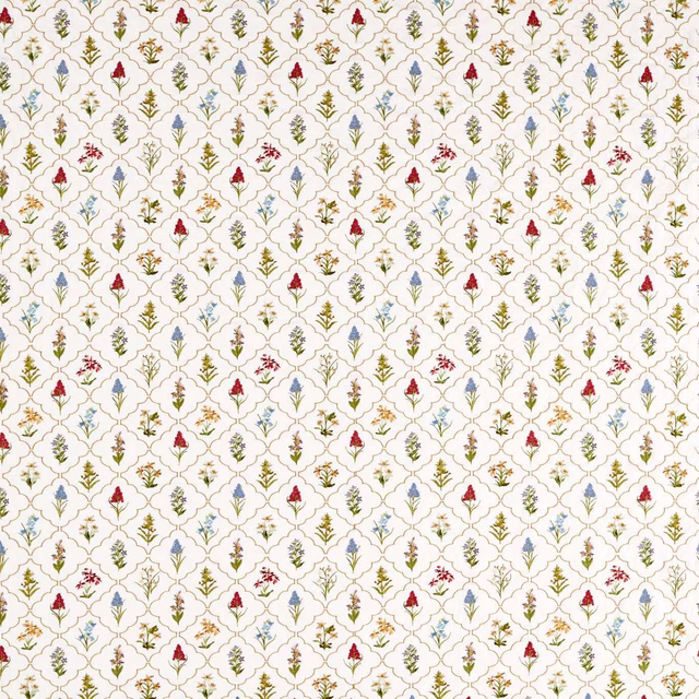 Cream embroidered fabric with tiny red, blue and green floral sprigs