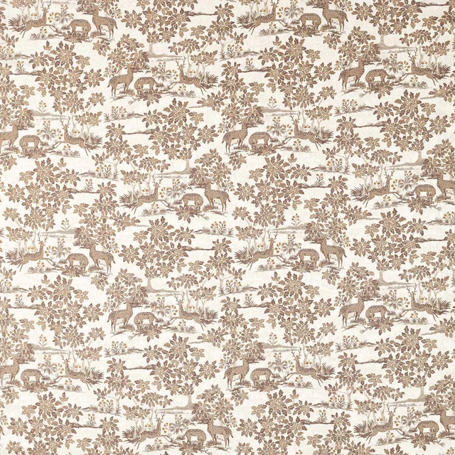 Close-up of beige woodland print fabric with deer, trees and leafy branches