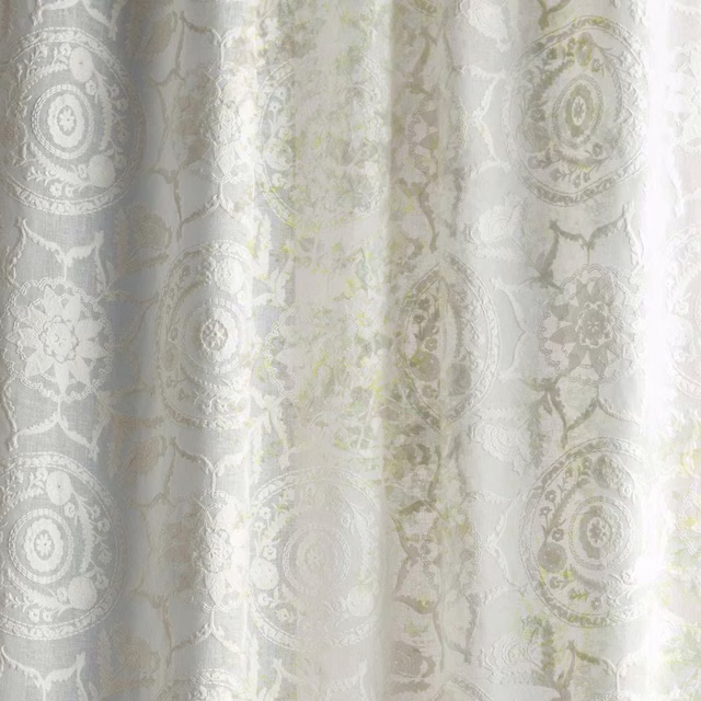 Soft white sheer fabric with large damask medallions and pale seaspray motifs