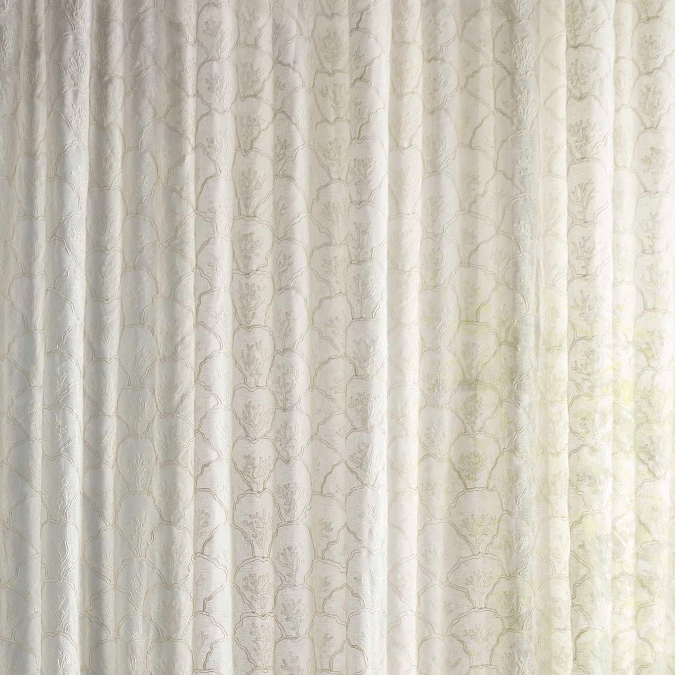 Sheer ivory cream fabric with faint botanical pattern and soft filtered light