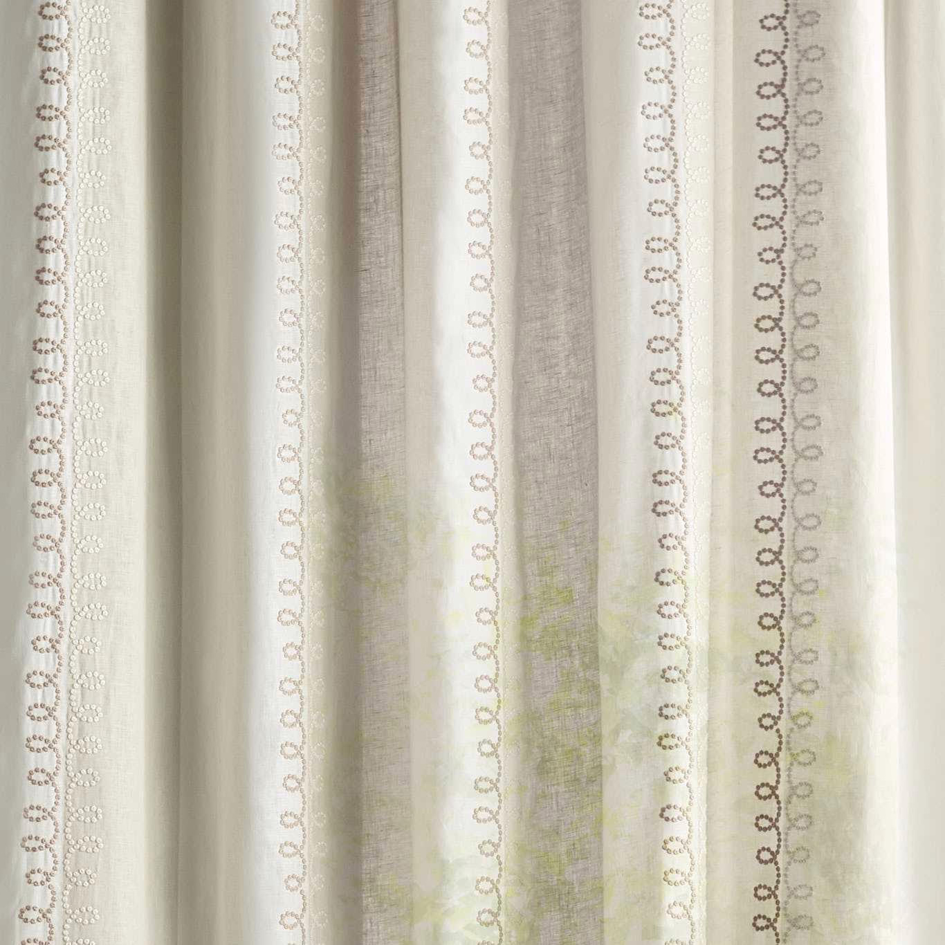 Cream sheer fabric with vertical looped stripe motifs in soft sand tones