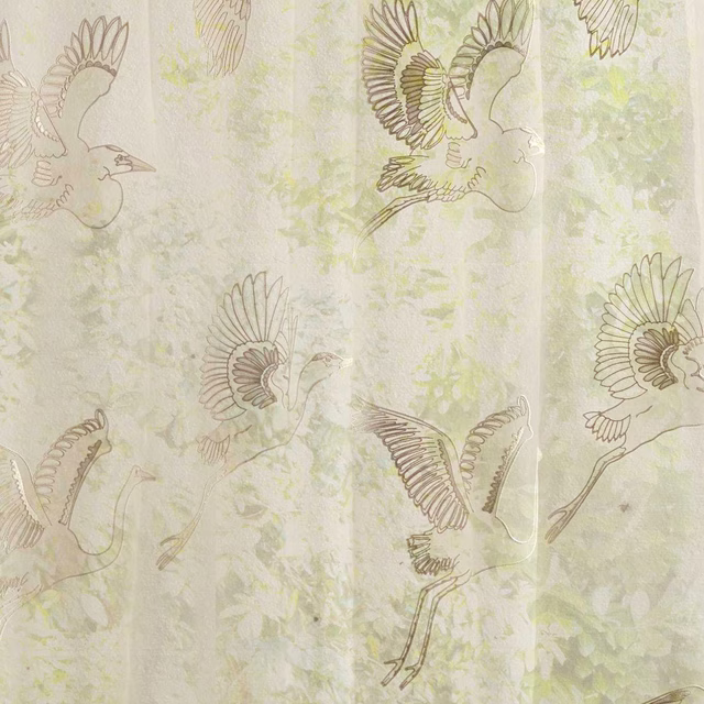 Sheer cream fabric with large outlined egret birds and soft sage mottling