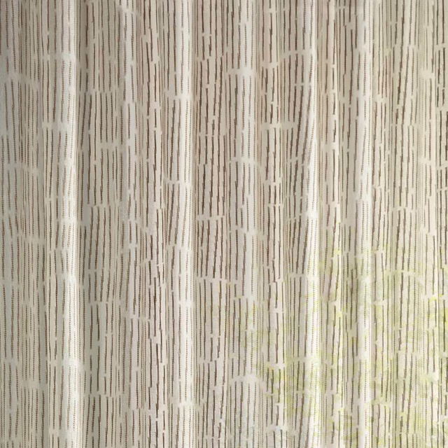 Sheer Sanderson fabric in sand tones with vertical dashed stripe pattern
