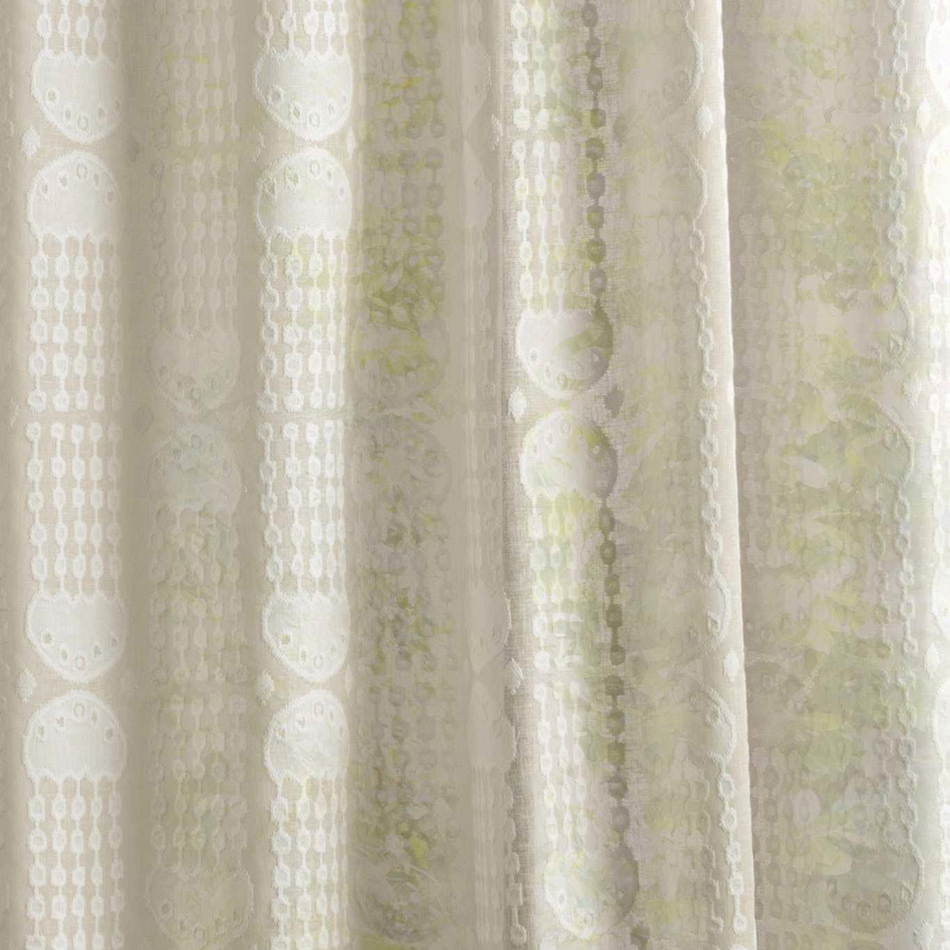 Cream sheer fabric with vertical oval motifs and pale green accents