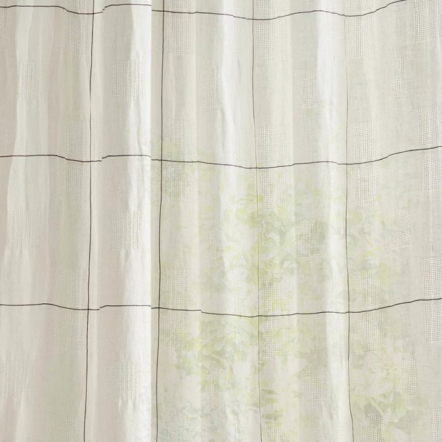 Creamy sheer check fabric with soft seaspray tint and fine woven grid
