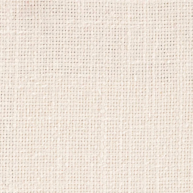 Close-up of soft chalk cream woven fabric with subtle slubbed texture