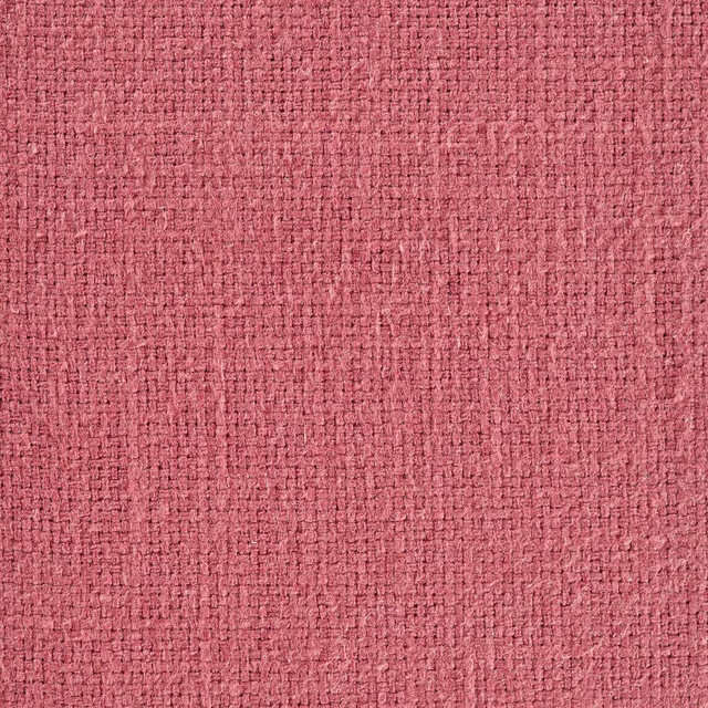 Close-up of dusky rose pink woven fabric with a textured plain weave