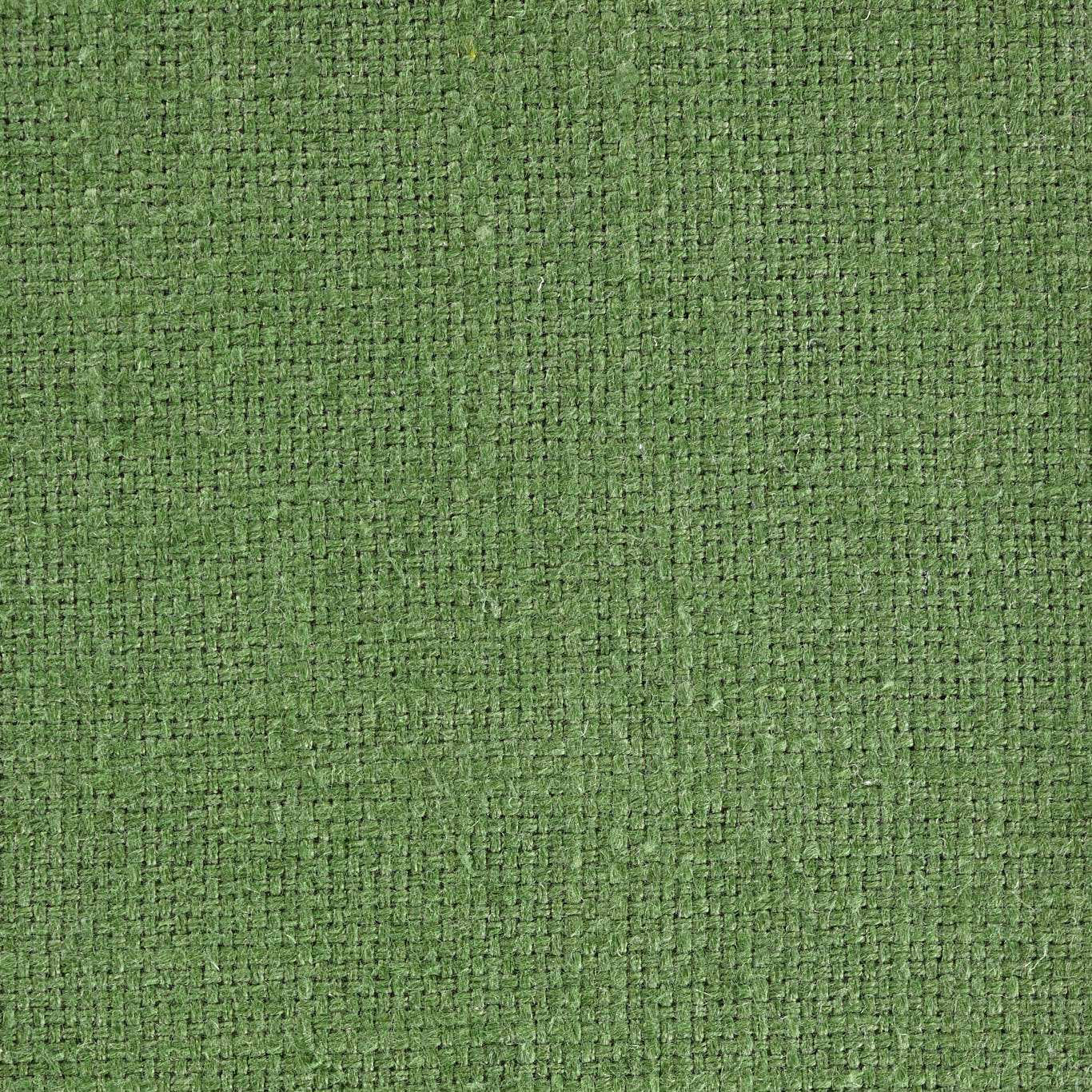 Close-up of a fresh cactus green woven fabric with a tight textured grid