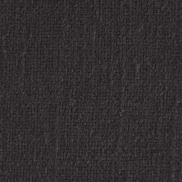 Close-up of deep charcoal black textured woven fabric with a dense plain weave