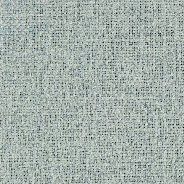Close-up of pale duck egg blue woven upholstery fabric with fine textured weave