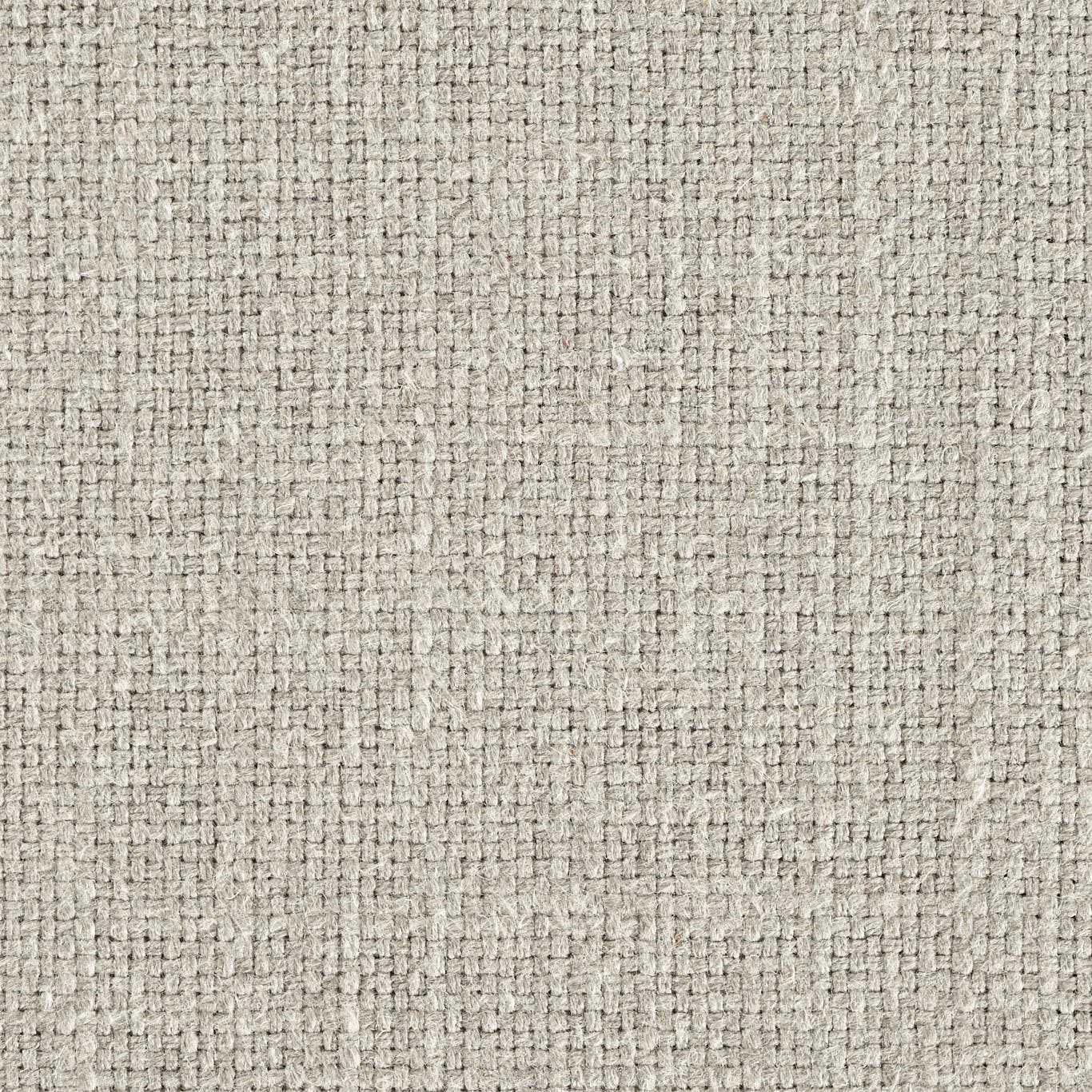 Close-up of a soft beige woven fabric with a fine textured plain weave