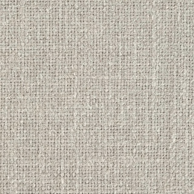 Close-up of a soft beige woven fabric with a fine textured plain weave