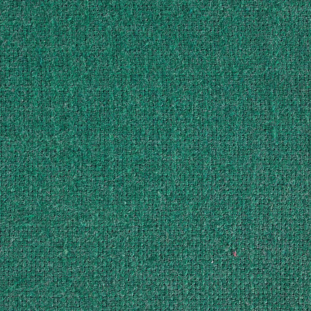 Close-up of textured evergreen green woven fabric with a nubby finish