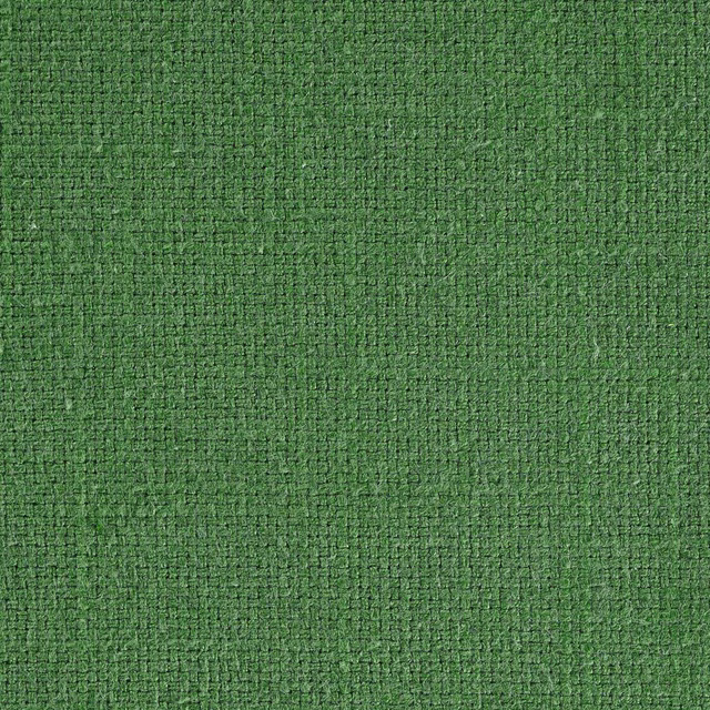 Close-up of a mossy green woven fabric with a dense, textured surface