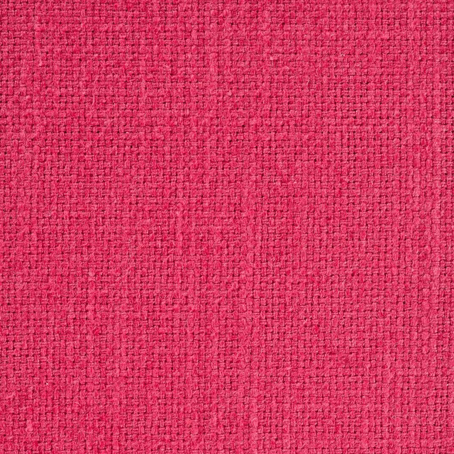 Close-up of bright fuchsia woven fabric with a tight textured basket weave