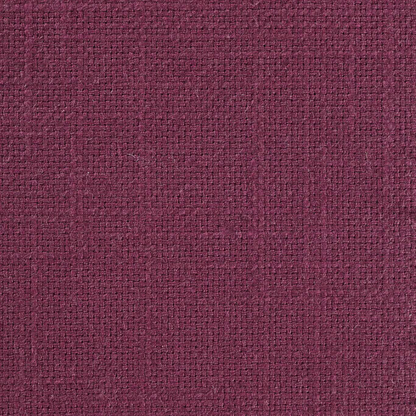 Close-up of a deep grape plum woven fabric with a tight textured surface