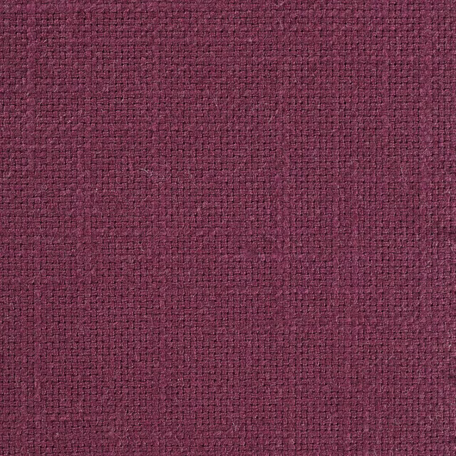Close-up of a deep grape plum woven fabric with a tight textured surface