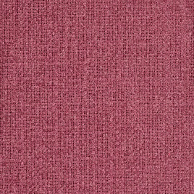 Close-up of a muted heather rose woven fabric with fine textured surface