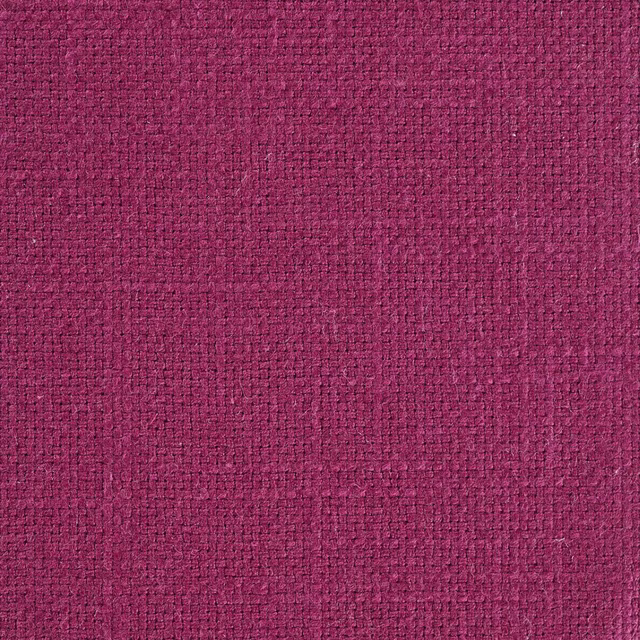 Close-up of a deep mulberry pink woven fabric with a textured basket weave