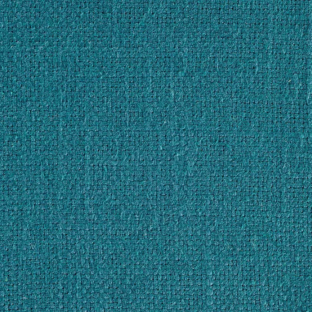 Close-up of a deep teal green woven fabric with a dense textured surface